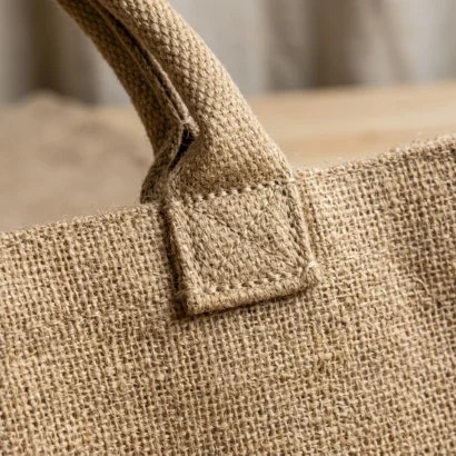Natural jute shopping bag filled with organic produce and greens for sustainable corporate promos UAE