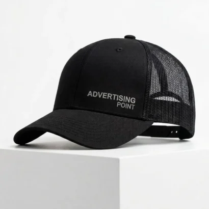 Custom Swift Santhome black 6-panel trucker cap studio view showing mesh back for Advertising Point UAE