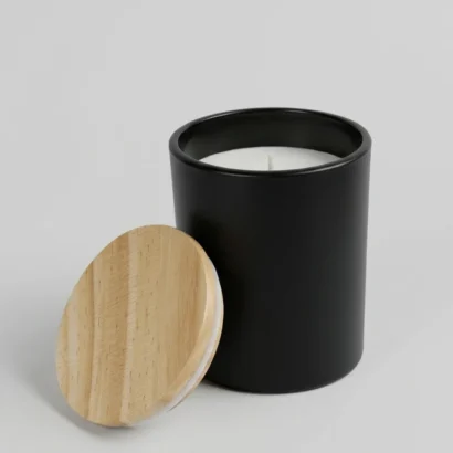 Luxury scented candle in glass bottle with natural bamboo lid studio view for Advertising Point UAE