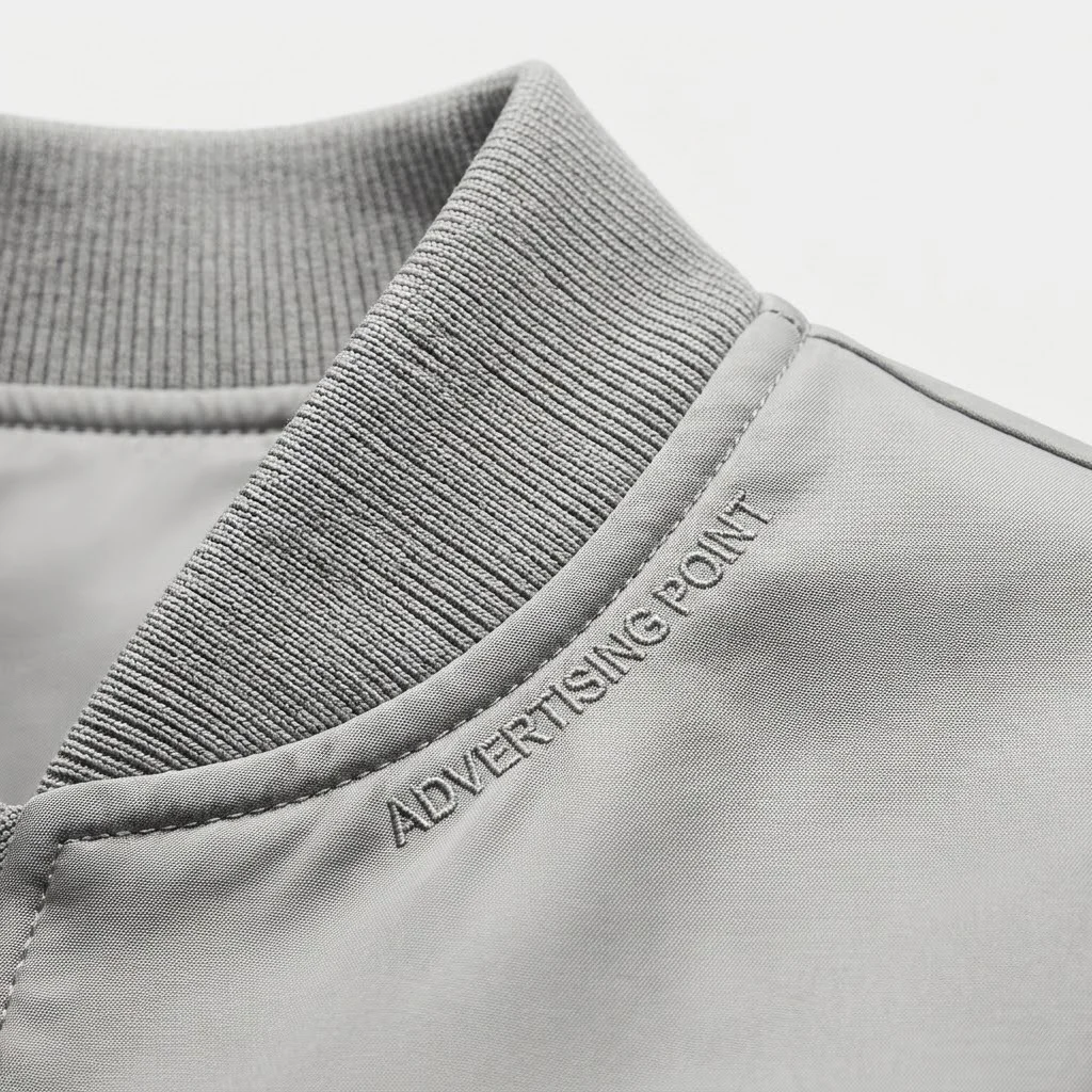 Macro close-up of ribbed collar trim and smooth dual-sided fabric texture on custom women jackets UAE
