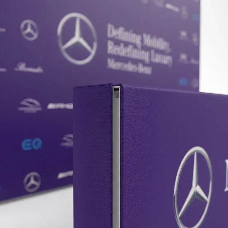 Macro close-up of realistic wood grain pattern and matte print finish on promotional backdrops UAE