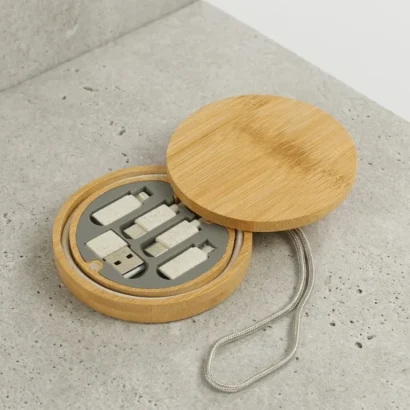 Universal multi-charging cable set in round bamboo case studio view for Advertising Point UAE