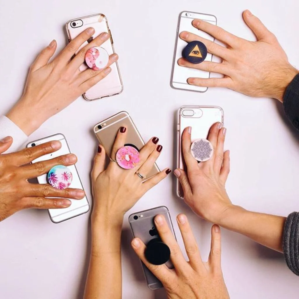 Pop socket mobile grip used as a hands-free phone stand UAE